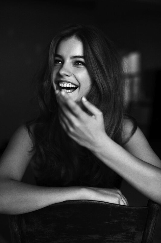 woman laughing in black and white