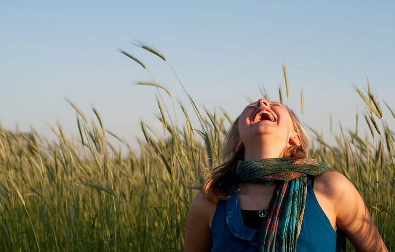 Woman Laughing in Field