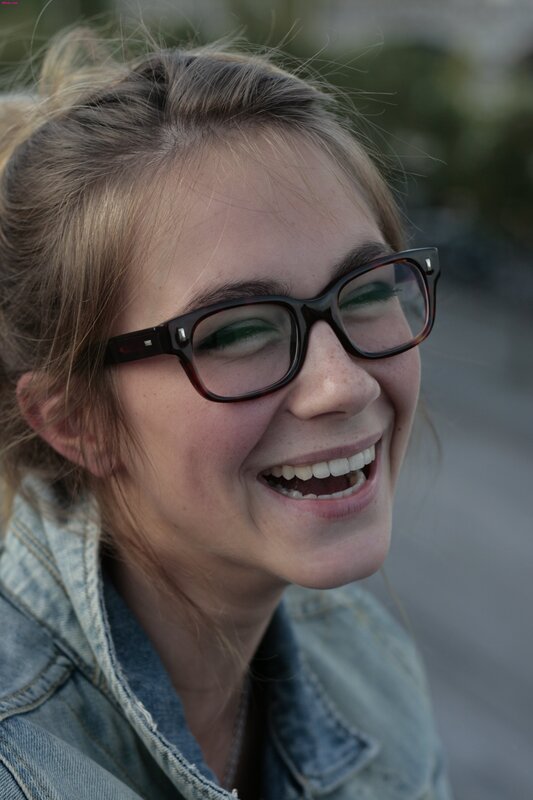 woman laughing in glasses