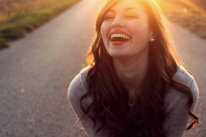 woman laughing in golden light