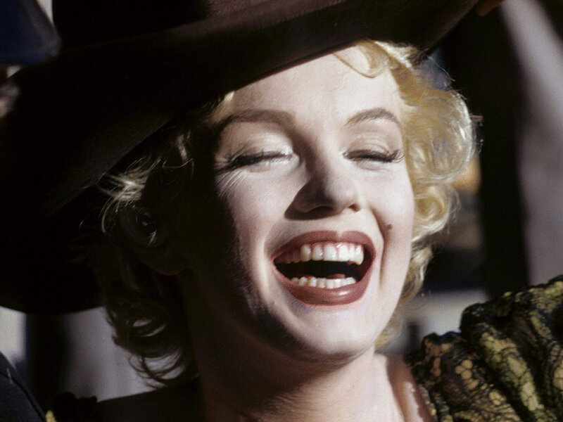 Woman Laughing in Hat
