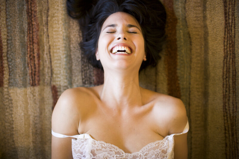 woman laughing in lace top