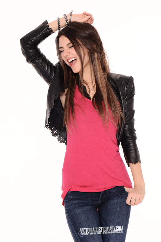 woman laughing in leather jacket