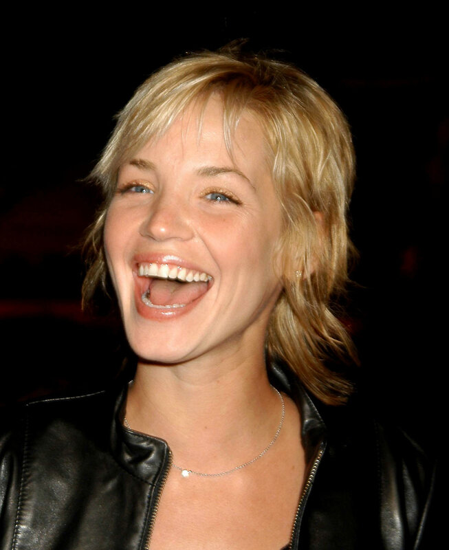 woman laughing in leather jacket