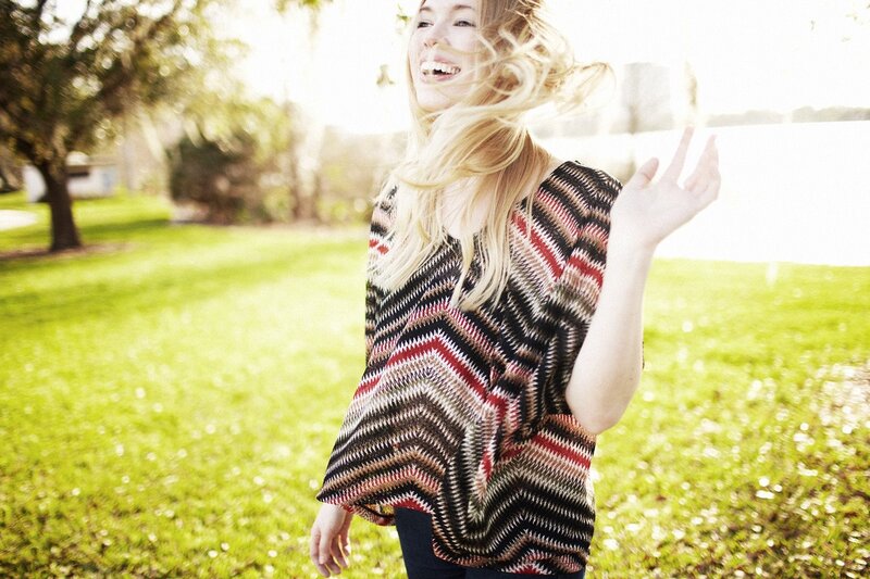 woman laughing in park
