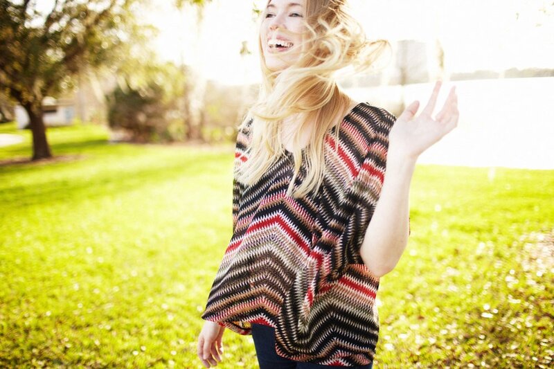 Woman laughing in park