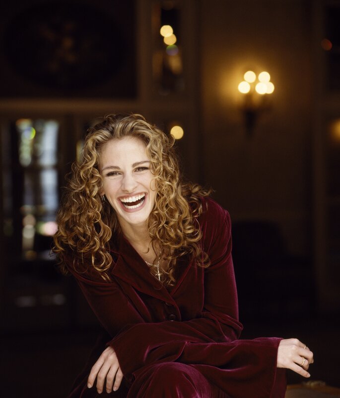 woman laughing in red velvet