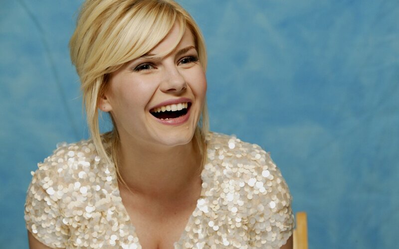 woman laughing in sequin top