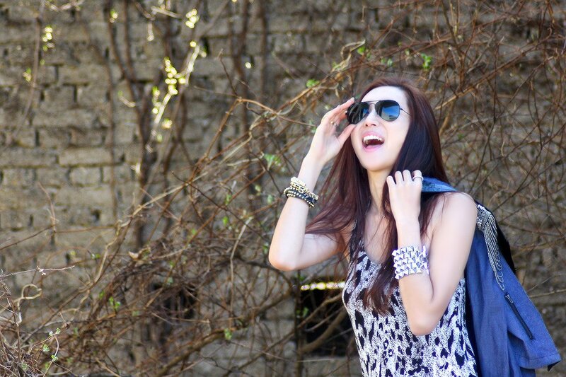 woman laughing in sunglasses