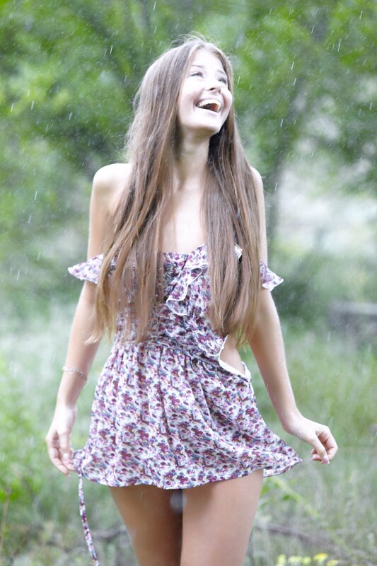 Woman laughing in the rain