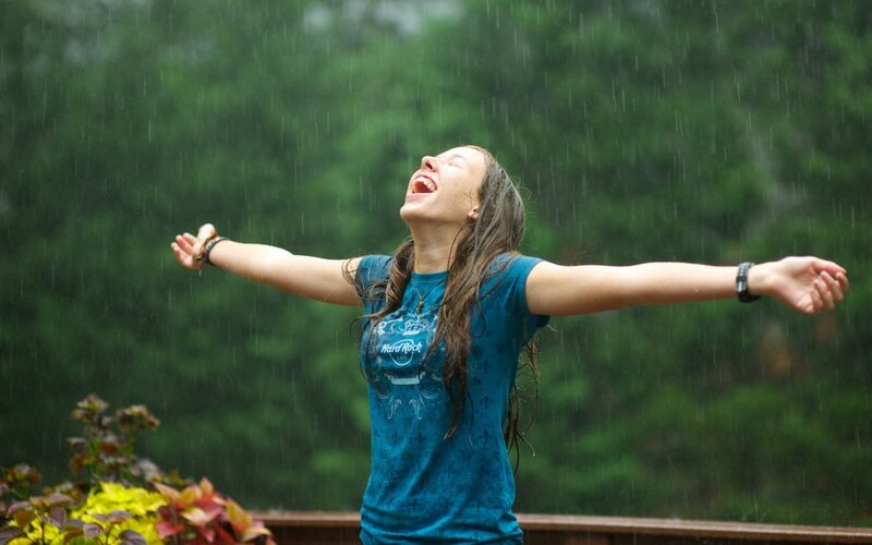 woman laughing in the rain
