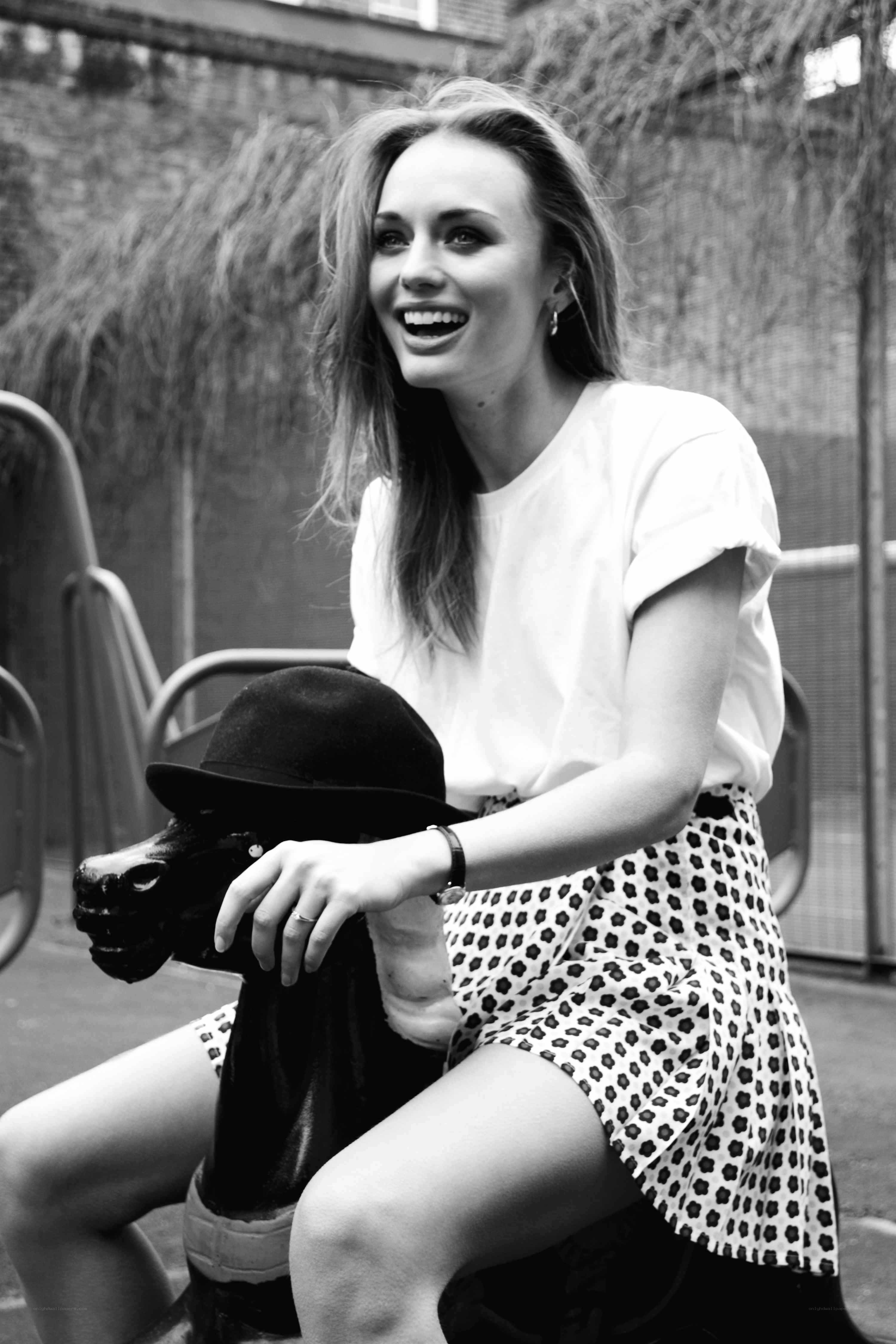 woman laughing on a carousel