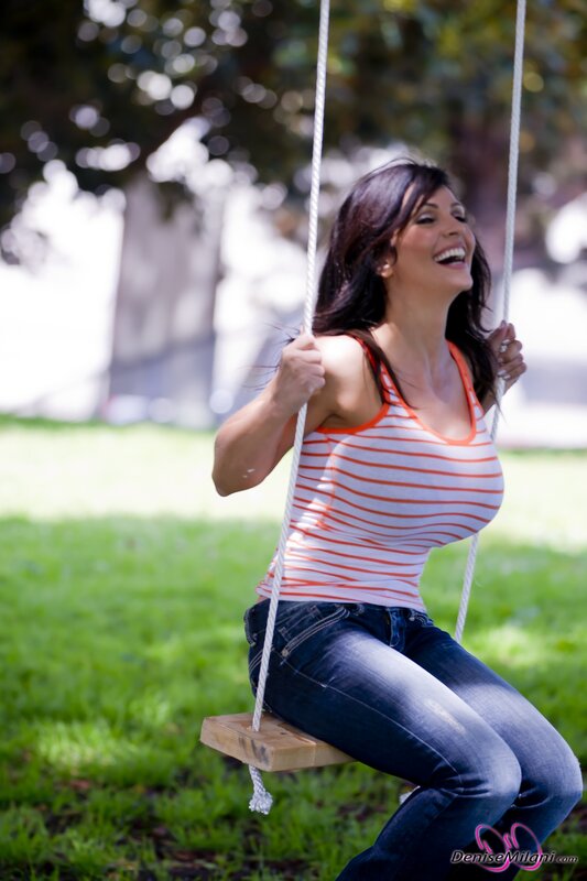 Woman laughing on a swing