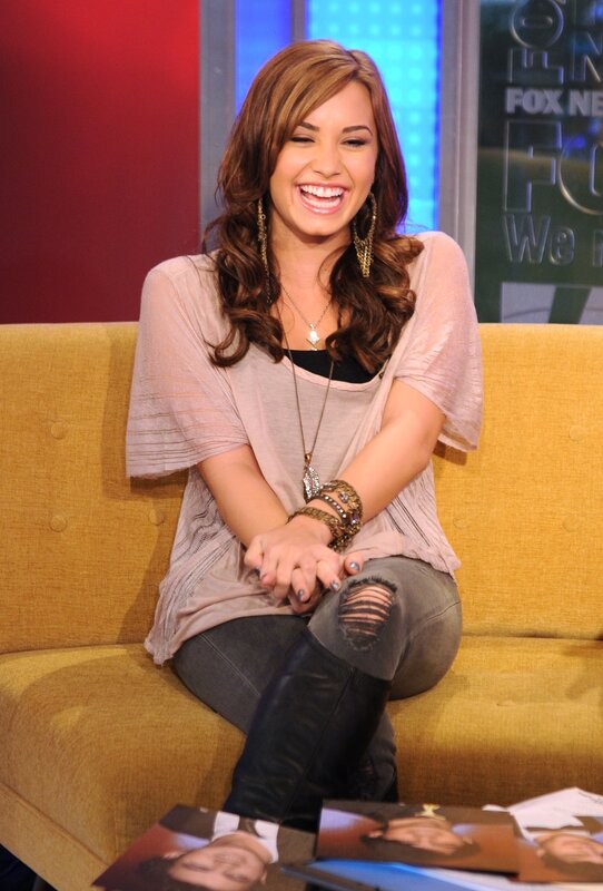 woman laughing on a talk show