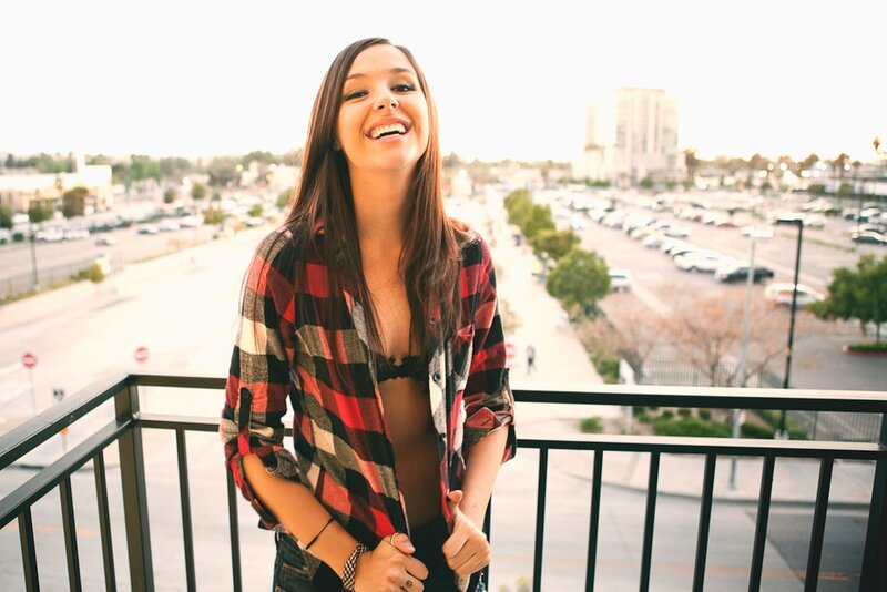 woman laughing on balcony