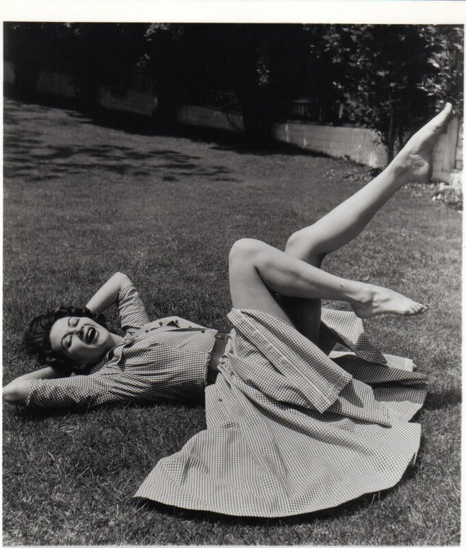 Woman laughing on grass