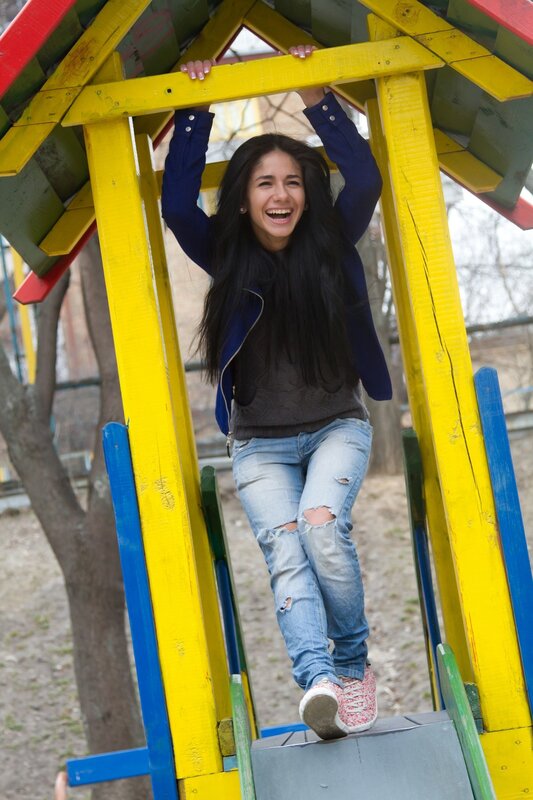 Woman laughing on playground