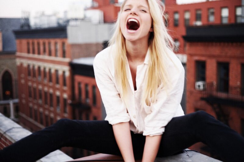 woman laughing on rooftop