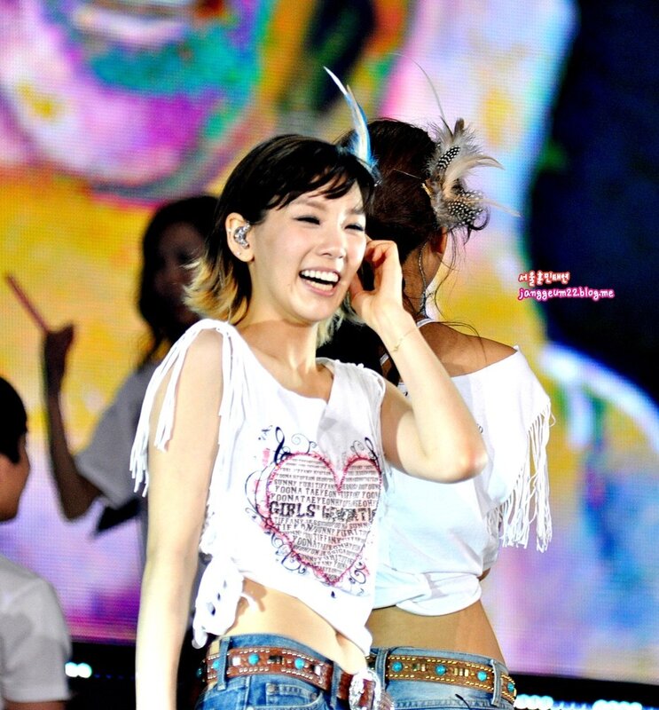 woman laughing on stage