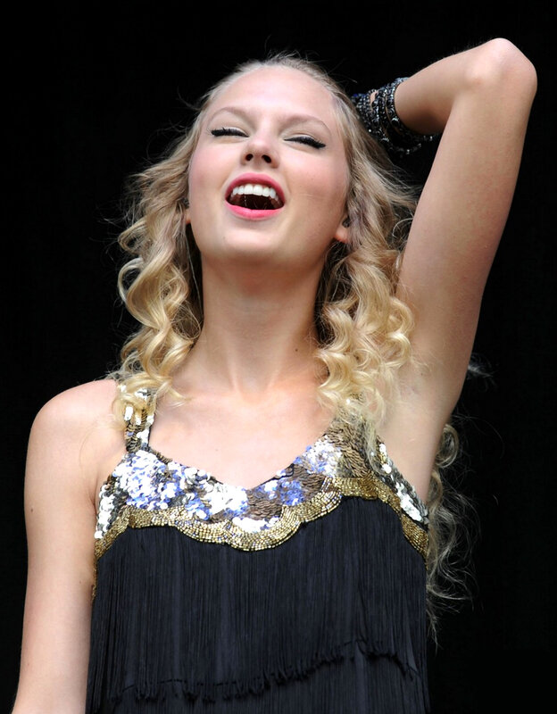 woman laughing on stage