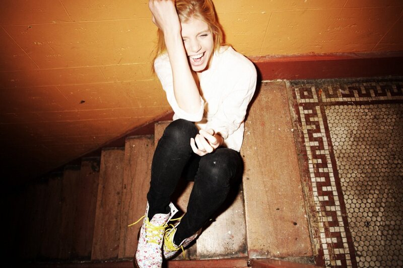 woman laughing on stairs