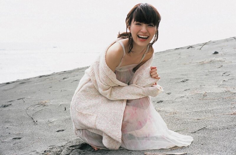 Woman laughing on the beach