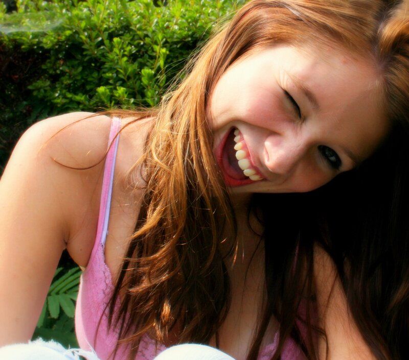 woman laughing outdoors