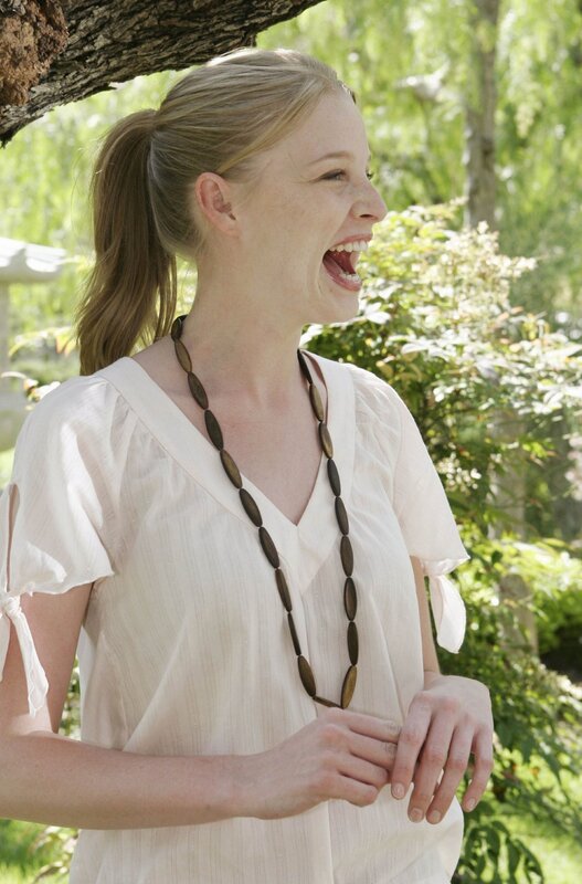 woman laughing outdoors