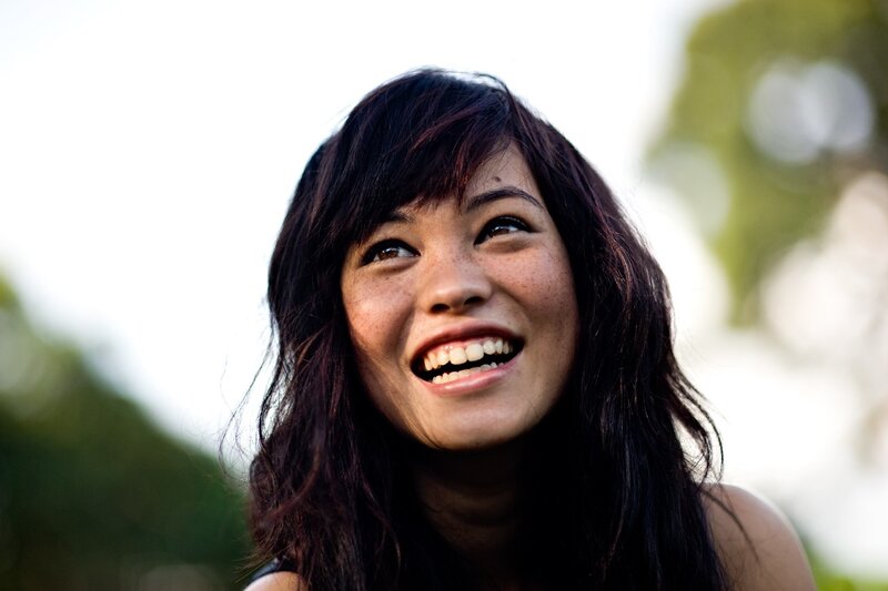 woman laughing outdoors