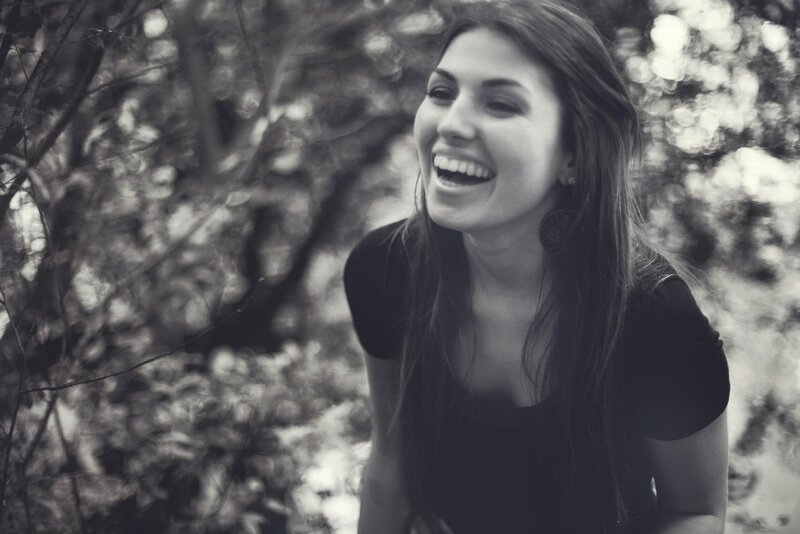 woman laughing outdoors