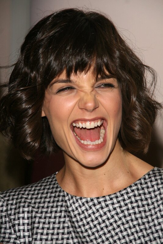 woman laughing widely