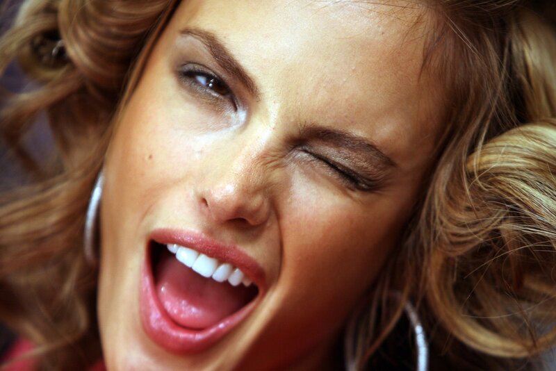 woman laughing with eyes closed