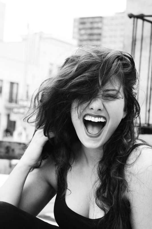 woman laughing with hair in face
