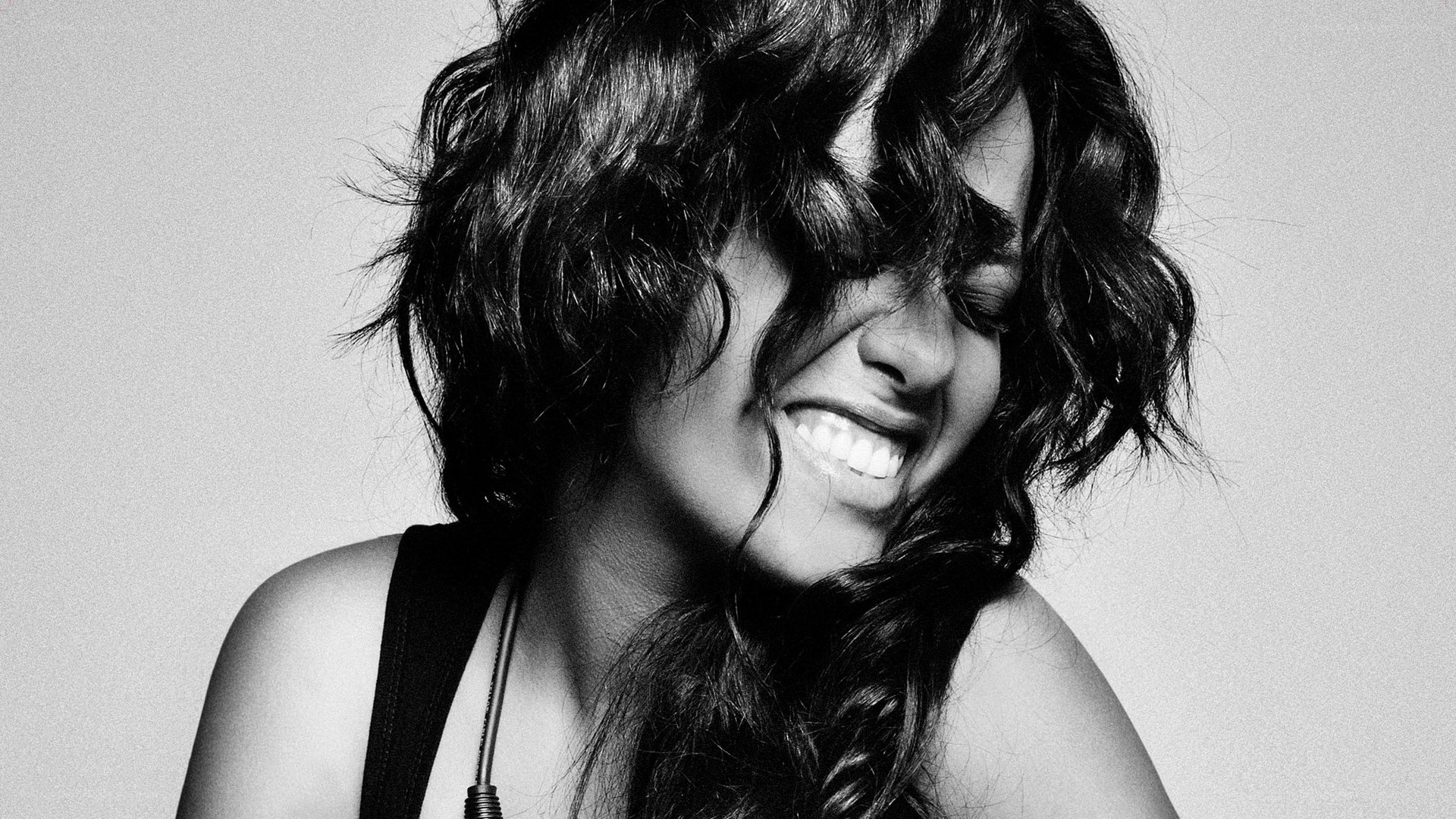 woman laughing with hair in face