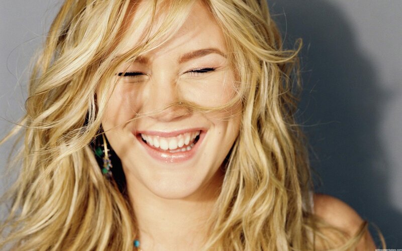 woman laughing with windblown hair