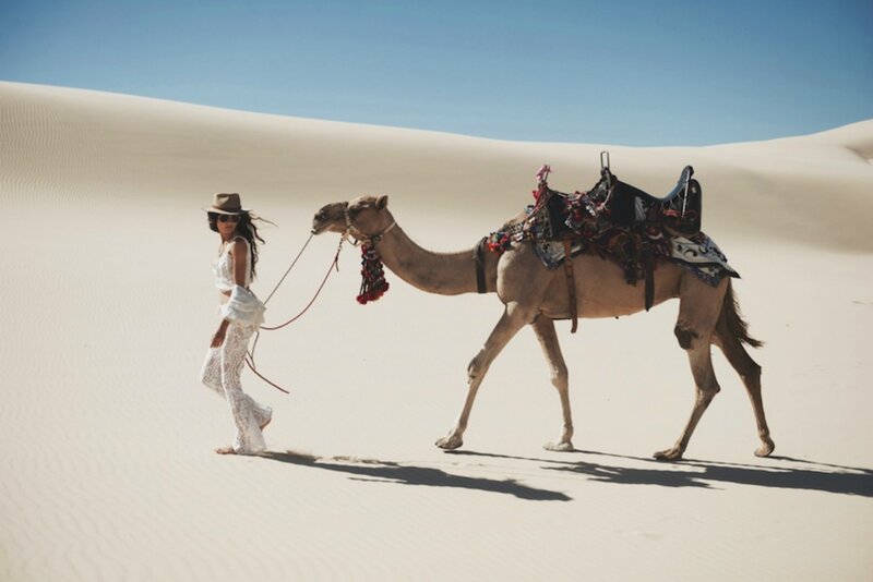 Woman Leading Camel