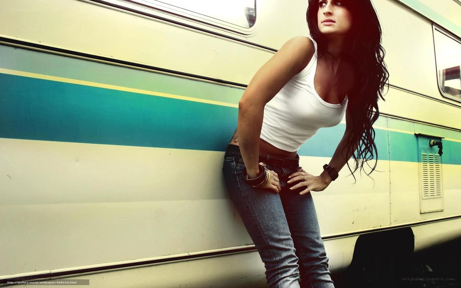 woman leaning against a bus