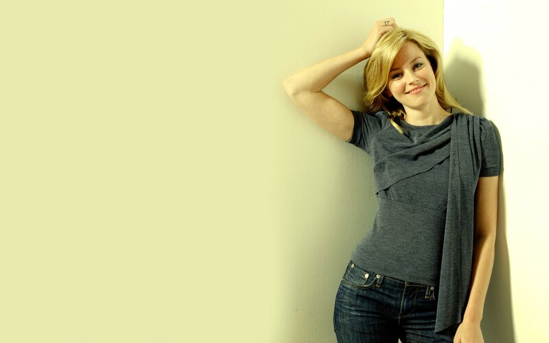 woman leaning against a wall