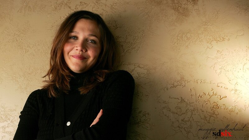 woman leaning against a wall