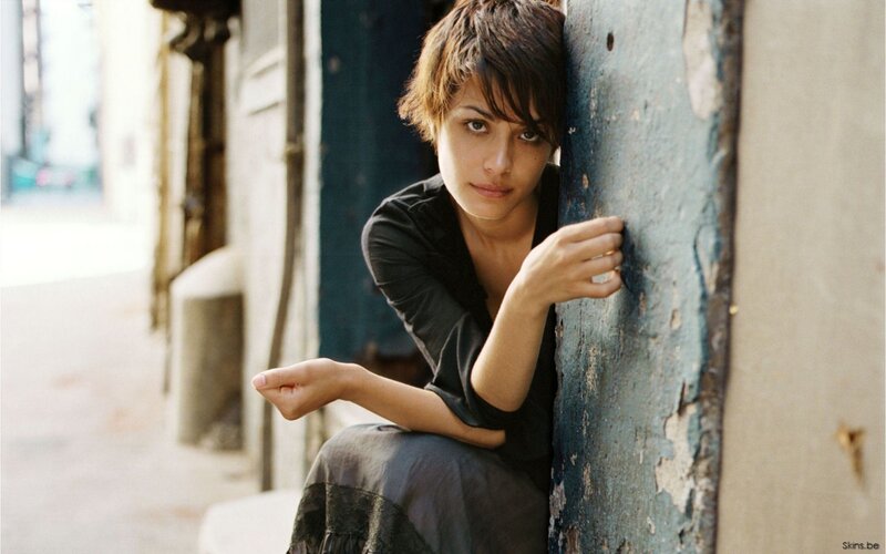 woman leaning against a wall