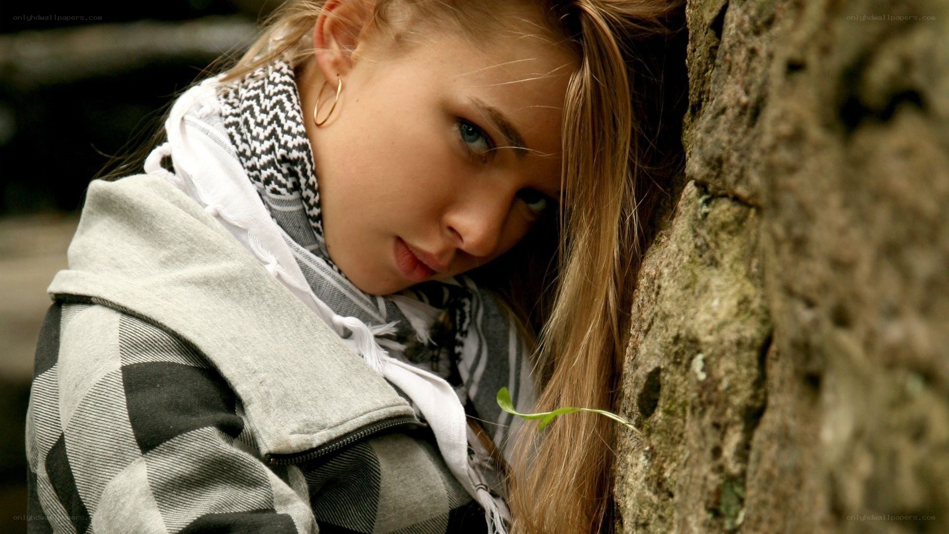 woman leaning against tree
