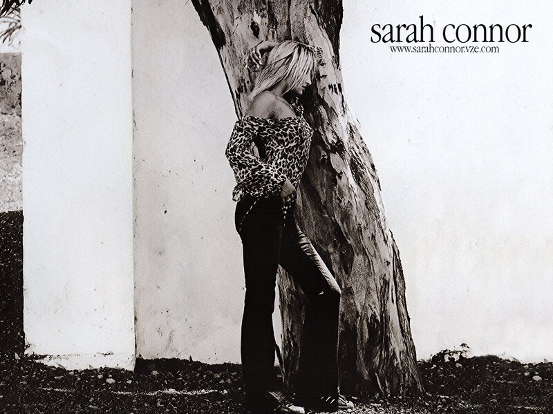 woman leaning against tree