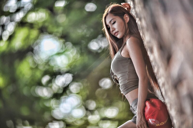 Woman Leaning Against Tree — Green, Serene, Afternoon, Photograph