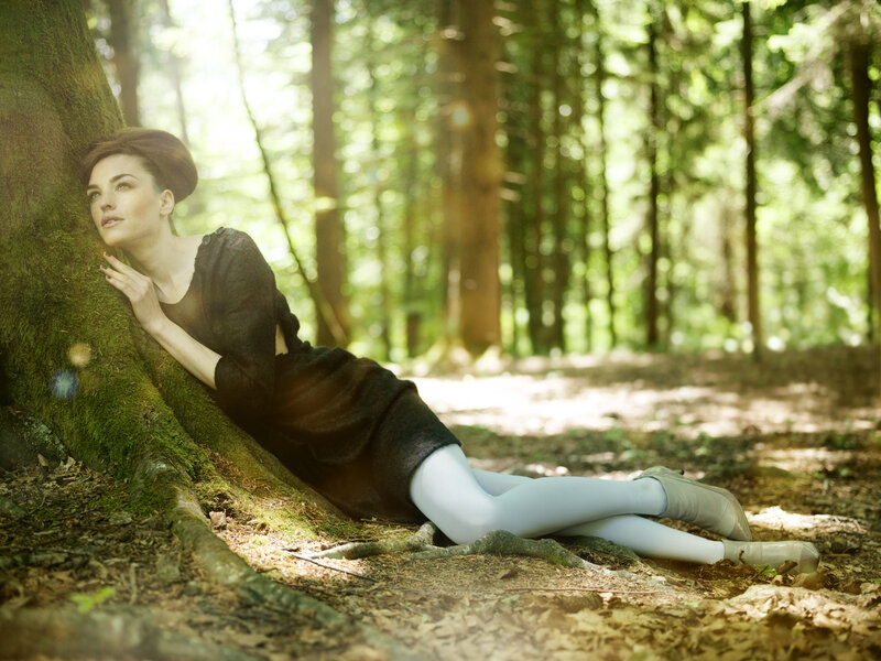 Woman Leaning Against Tree — Green