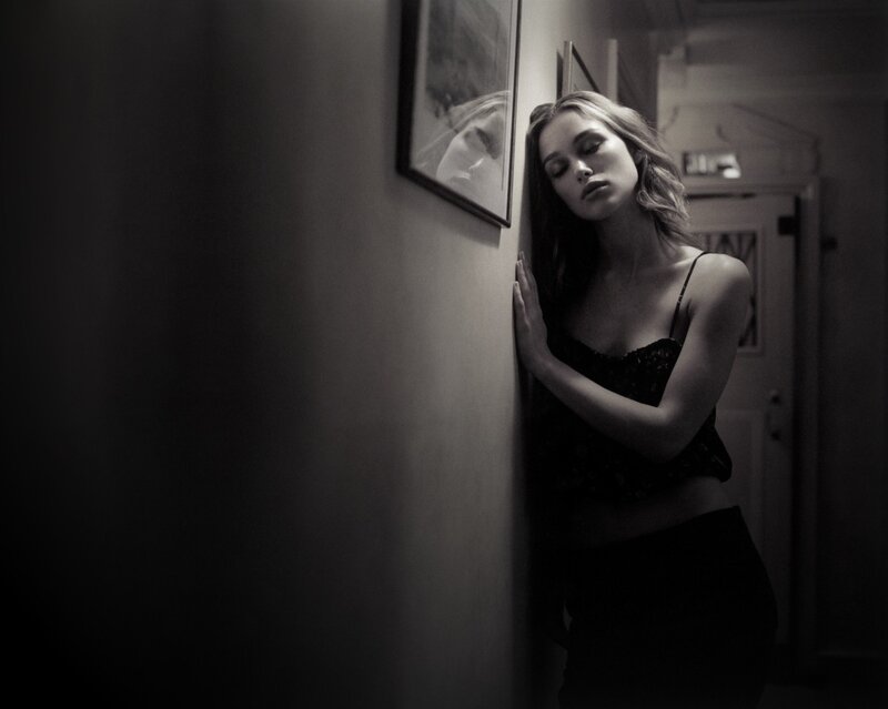 woman leaning against wall