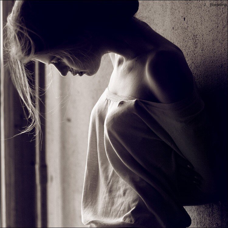 woman leaning against wall