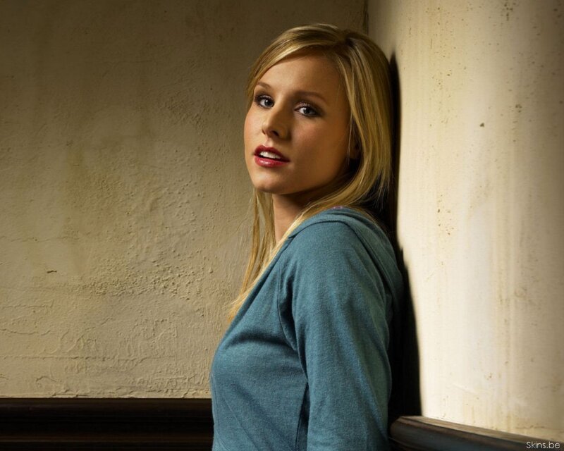 woman leaning against wall