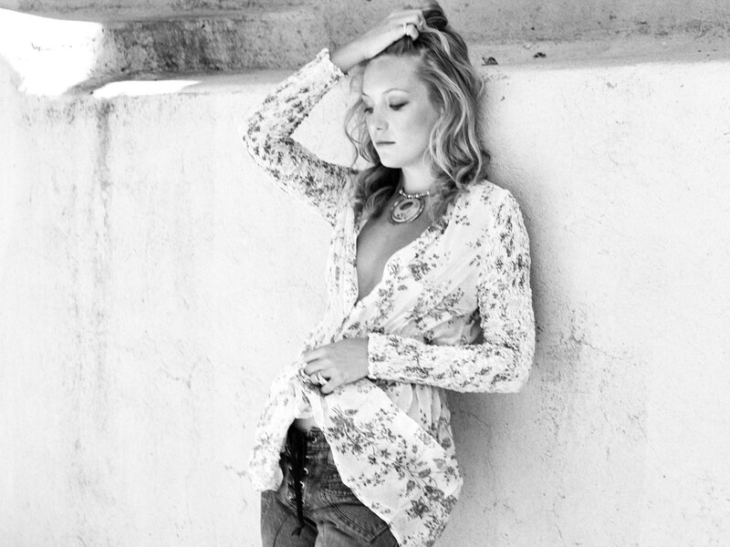 woman leaning against wall