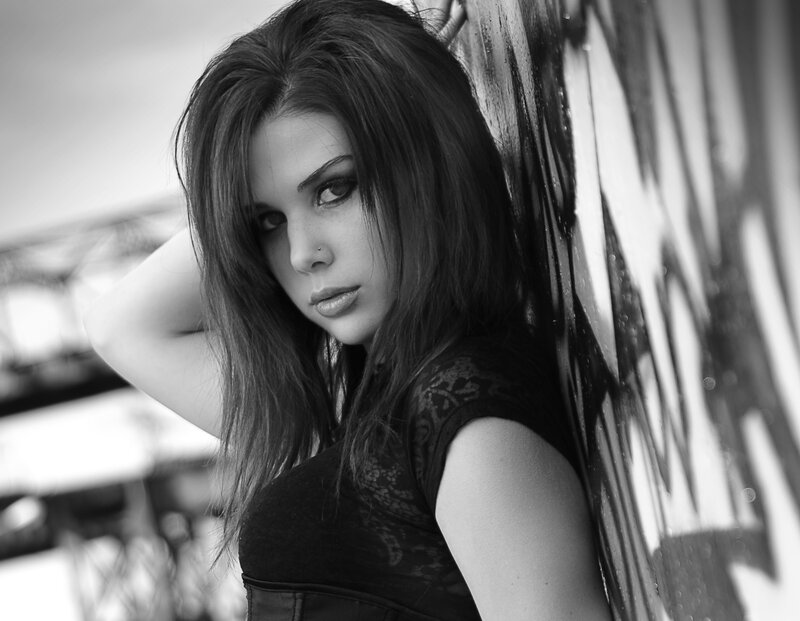 woman leaning against wall