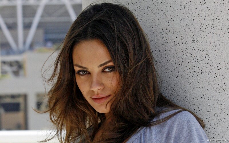woman leaning against wall